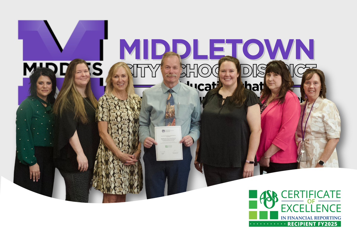 photo of finance department team with award and a MCSD background